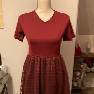 Burgundy cocktail dress. Never worn. Purchased at a local boutique.